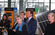 Mayor Gayle McLaughlin addresses reporters at SunPower Corp. on Jan. 27, 2010. Gov. Schwarzenegger stands at right.