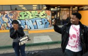 Ginea Jack, 17, left, and Xavier Polk, 16, explore their surroundings with digital cameras at the RYSE center.  Polk says he never looks through the camera when taking a picture. "My imagination helps me take my pictures," Polk said. "The pictures I take are unexpected and great."