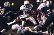 The Oilers defense tries to take down Kenneth Walker of the Eagles. (Photo by Tyler Orsburn)