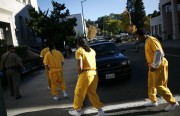 County sheriff's deputies escort defendants to the courthouse in the morning. Defendants shown (left to right) include Marcelles Peter, 18, Jose Montano, 19, Elvis Torrentes, 23, and John Crane Jr., 43.