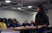 Jennifer Ly, a sustainability associate for the city, passes out Post-It notes to be used in a straw poll.