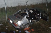 The BMW 528 involved in a Sunday crash sits in a ditch near Richmond Parkway and Goodrick Avenue. The back of the car reads: "La Santisima Muerte," or "The Most Holy Death."  (photo courtsey of: The Richmond Police Department)