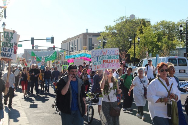 Protesters marched from the Richmond BART station on Friday to celebrate Earth Day and protest Chevron.