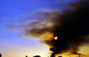 Smoke lingered above Richmond after a Chevron refinery fire on Aug. 6th. photo by: Tawanda Kanhema