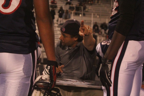 The Oiler's Defensive Coordinator Greg Morris identifies an adjustment he wants his players to make on the field. (Photo: Stephen Hobbs)