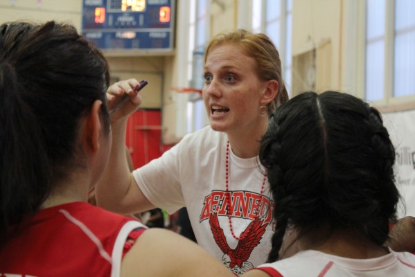 Head Coach Lisa Schaaf talks to her players between sets. Schaaf, a math teacher at Kennedy High School, also coaches the girl's JV team. (Photo: Stephen Hobbs)