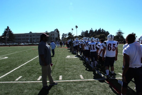 The Oilers line up to shake hands with the Pride after a 28-6 loss. (Photo by Rachel de Leon)
