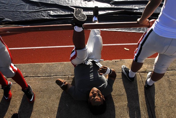Christian Guevara stretches his legs prior to the game. (Photo by Tyler Orsburn)