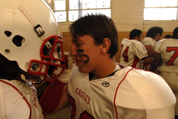 Jacob Qualls pumps up a teammate prior to the game against Joseph Bethel. Bethel went on to defeat Kennedy Friday night in Vallejo, 27-16. (Photo by Tyler Orsburn)