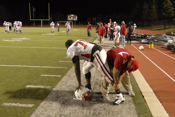Kennedy player Jaimmion Young cramps up during the game. Bethel went on to defeat Kennedy Friday night in Vallejo, 27-16. (Photo by Tyler Orsburn)