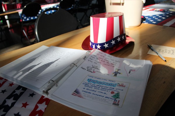 Their Angels, a group that sends care packages to soldiers overseas, displays some of the letters others have written. (Photo by: Rachel de Leon)