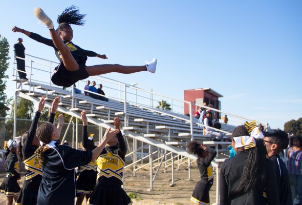 Young cheerleaders on the Steelers can perform acrobatic stunts often seen at the high school level. See more at their homecoming game this Saturday. (Photo by: Lauren Kate Rosenblum)