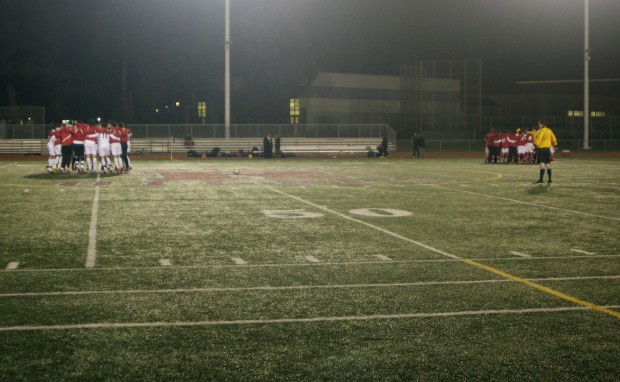 Both teams huddled up before Thursday's match, hoping to provide last minute motivation. The first meeting between the two teams resulted in a 1-1 tie. (Photo by: Stephen Hobbs)