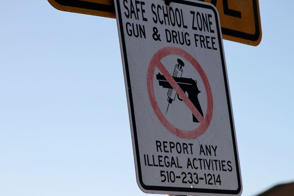 A sign hangs close to where Young was shot and killed. Photo by: Anne Hoffman.